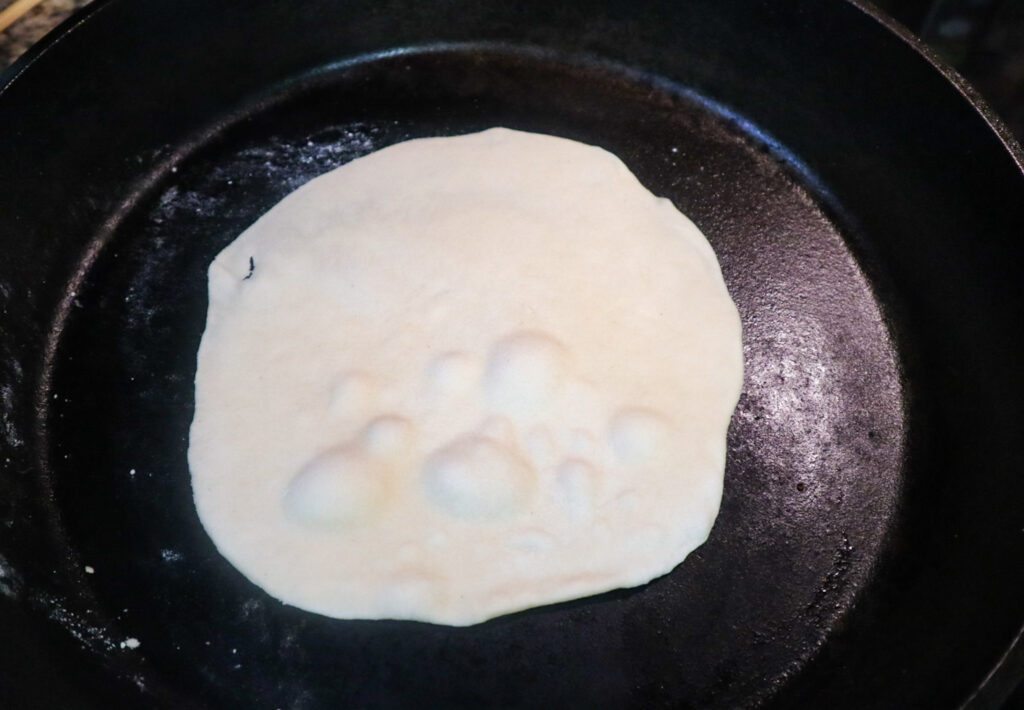 tortilla cooking in pan