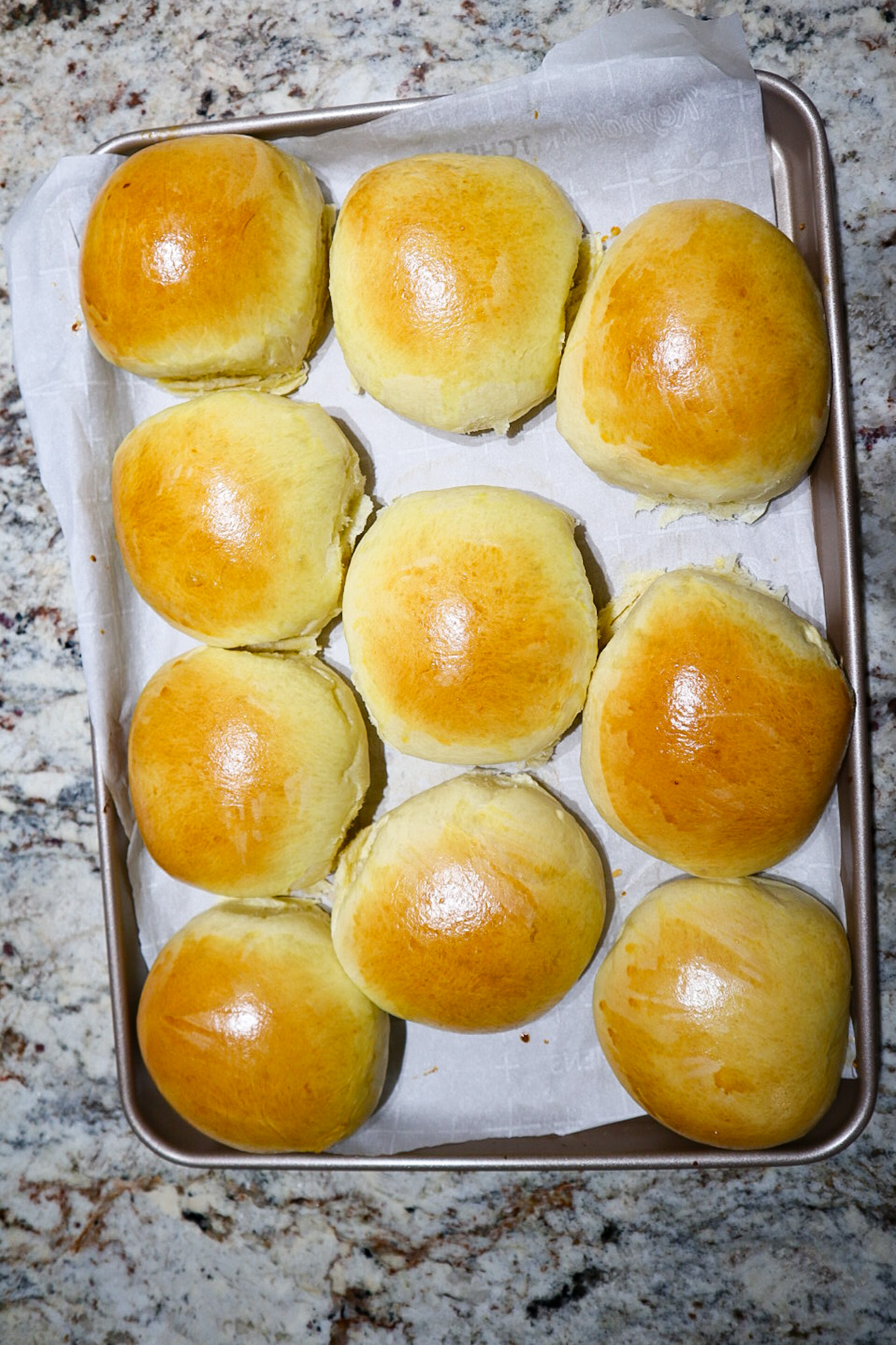 hamburger buns on baking tray