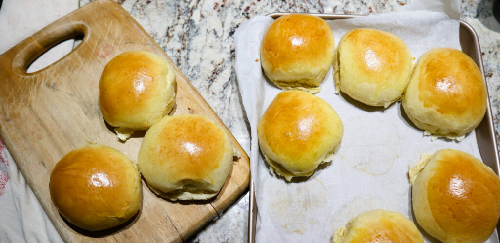 hamburger buns on a baking sheet