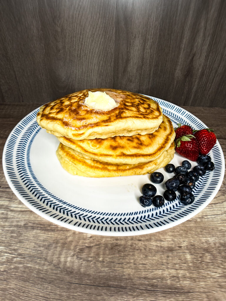 sourdough pancakes on a wooden counter top