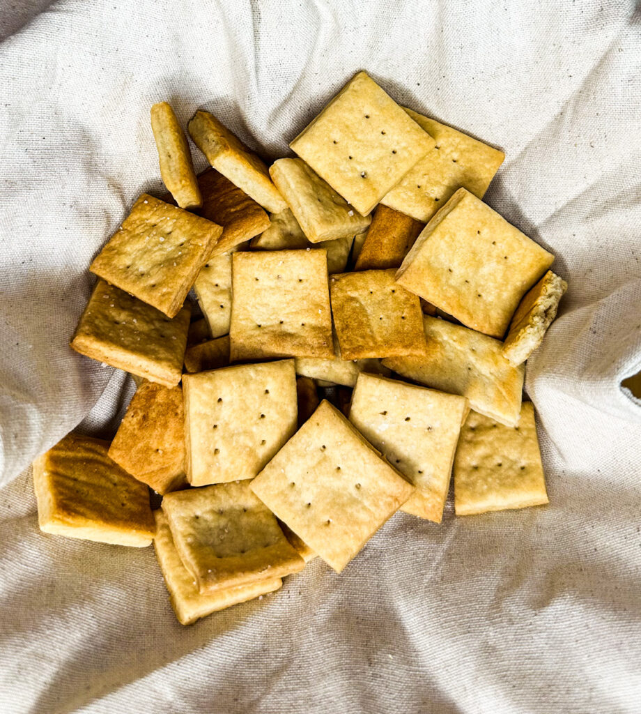 homemade sourdough discard crackers in a basket