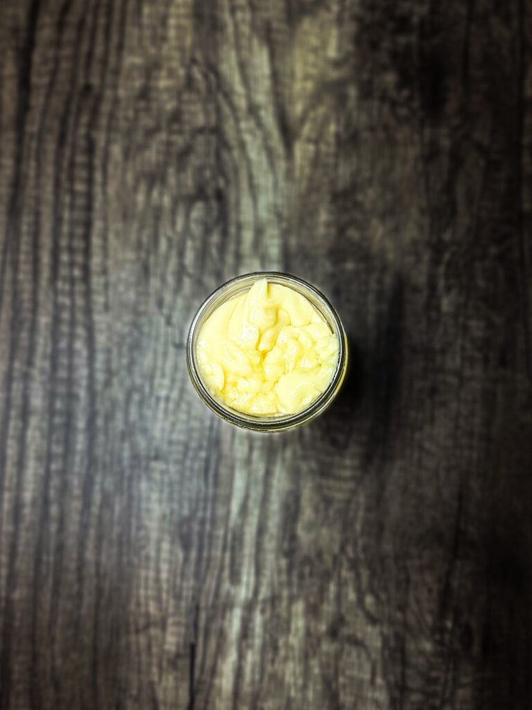 homemade mayonnaise on a wooden counter top