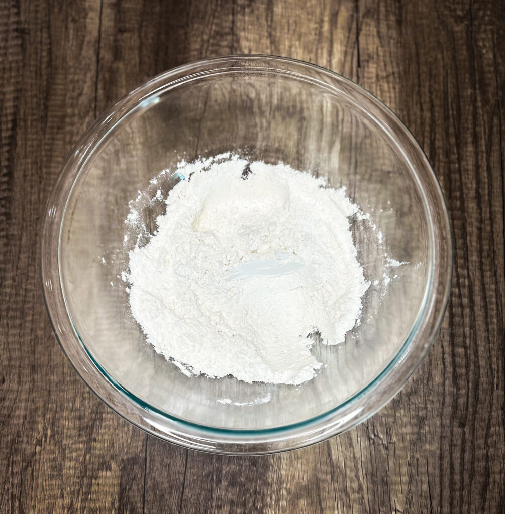 sourdough cracker ingredients in a glass bowl