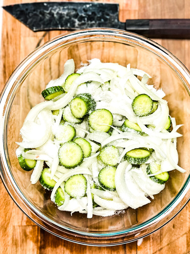 sliced cucumber and onions for bread and butter pickles